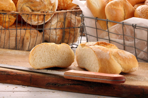 istock Sliced roll on a wooden board 672617980