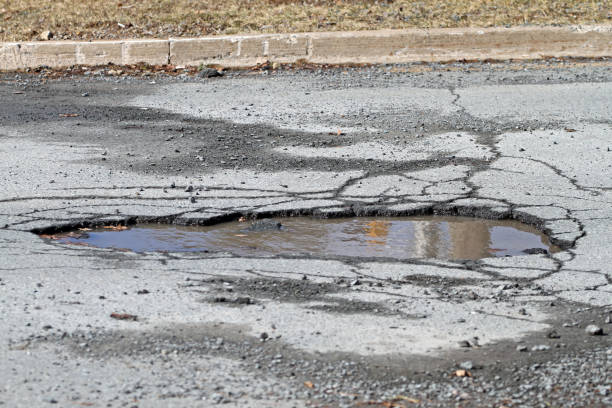 istock Pothole On A Road, Resulting In Hazardous Driving Conditions 672627456