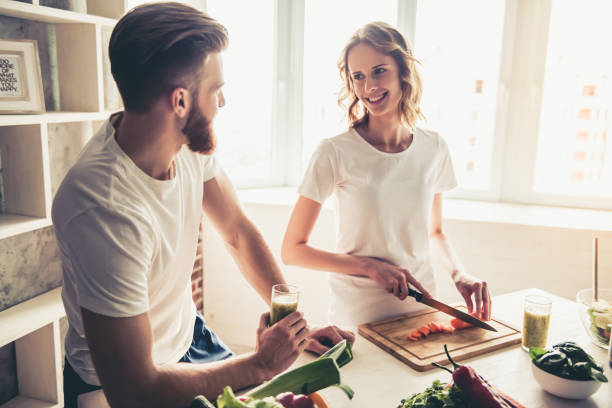 istock Couple cooking healthy food 672627462
