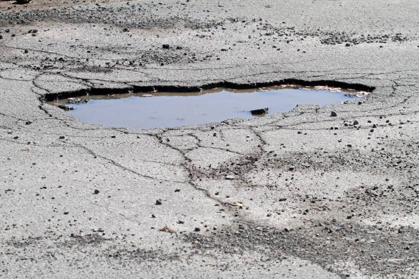 istock Pothole On A Road, Resulting In Hazardous Driving Conditions 672627482