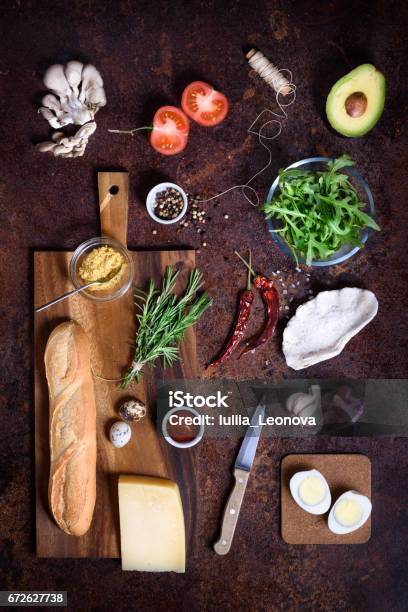Mock Up Sandwich And Cooking Ingredients Set On Rustic Brown Background Stock Photo - Download Image Now