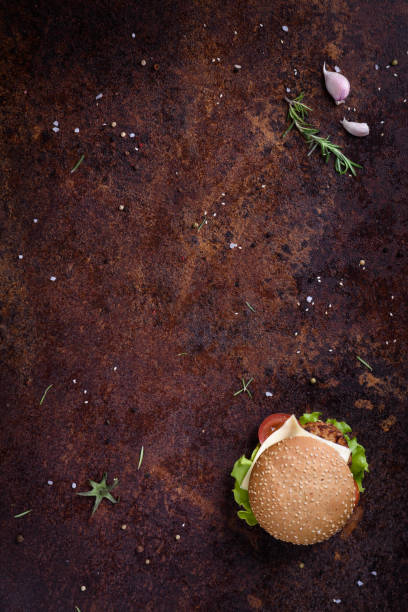 istock Beef burger in a sesame bun. Restaurant menu frame, mock up. 672629852