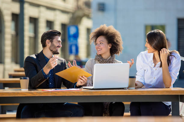 istock Young business people working outdoors 672629924