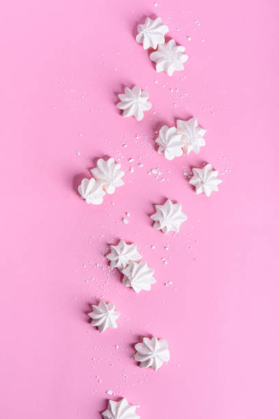 istock Meringue dessert over pink background. Bakery product. 672630134
