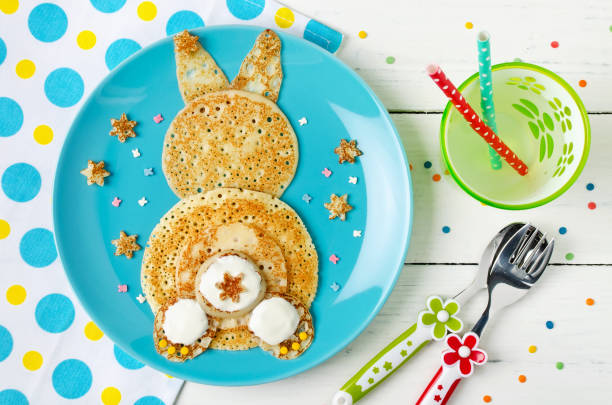 Funny bunny pancakes on the plate. Top view Funny bunny pancakes on the plate. Creative breakfast for kids. Top view bunny pancake stock pictures, royalty-free photos & images