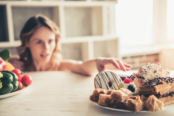 istock Woman choosing food 672630924
