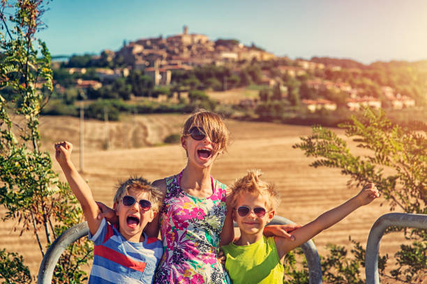 istock Kids enjoying vacations in Tuscany, Italy 672634542