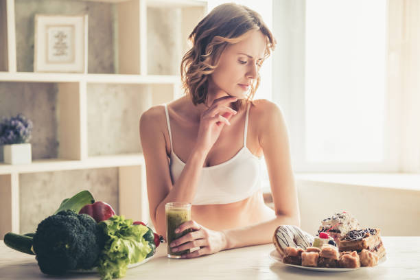istock Woman choosing food 672634748
