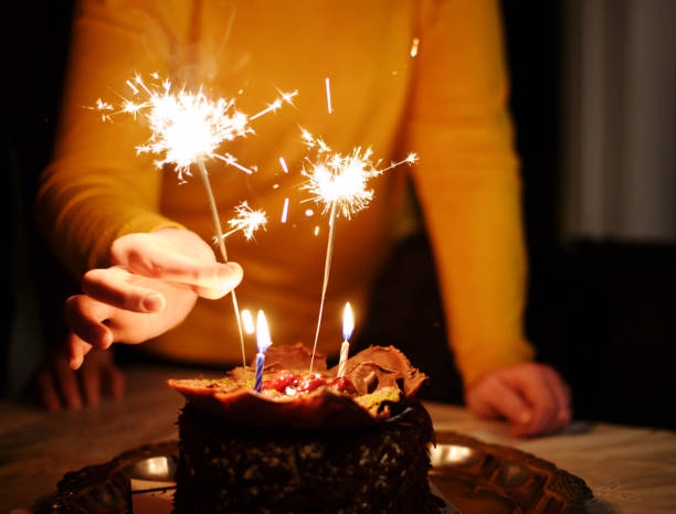 istock Birthday Cake With Lit Candles 672653998