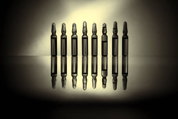 istock Ampoules with medicine closeup 672660540