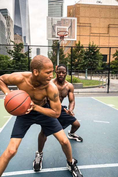 istock friends playing basketball in nyc 672663904