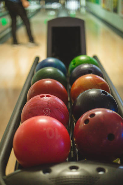istock Colorful bowling balls in a row 672672340