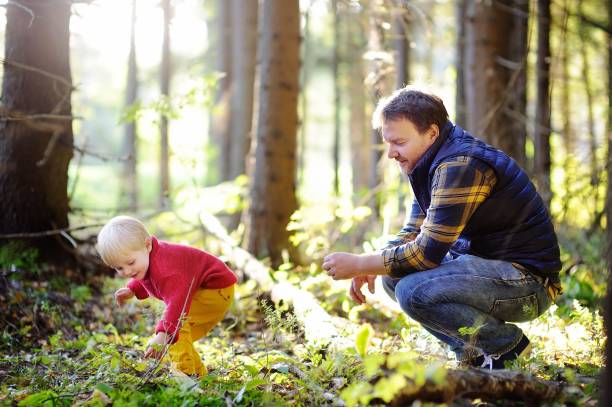 istock Father and his son walking during the hiking activities in forest 672685106
