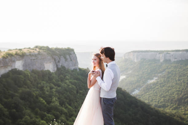 istock Wedding photo shoot in the mountains with stunning views 672689038
