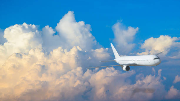 istock Air plane fly on the sky with blue and yellow cloud in morning 672696534