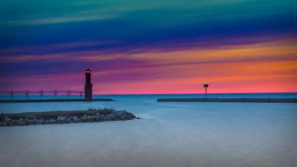 The lighthouse at Algoma on a sunny morning sunrise in Wisconsin along the shores of Lake Michigan.