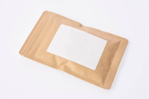 High angle view of brown package with blank label, isolated on white with clipping path.