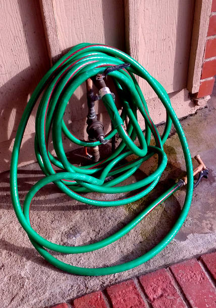 istock The Water Hose in the Front Yard 672714492