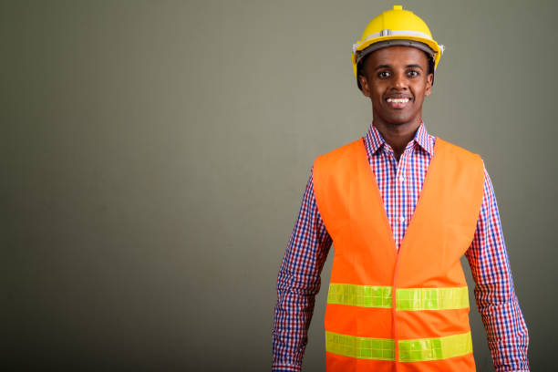 istock Studio shot of young African man construction worker against colored background 672717138
