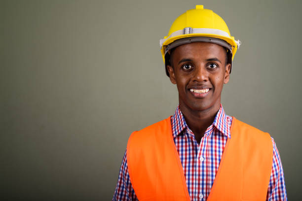istock Studio shot of young African man construction worker against colored background 672717208