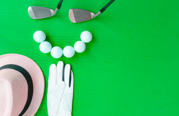 istock Golf concept : panama hat, golve, golf balls, golf clubs on wooden table. Flat lay with copy space. 672741218
