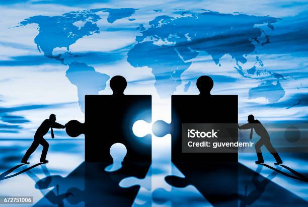 World Business Teamwork Puzzle Pieces Stock Photo - Download Image Now - Mergers and Acquisitions, Business, Global Business