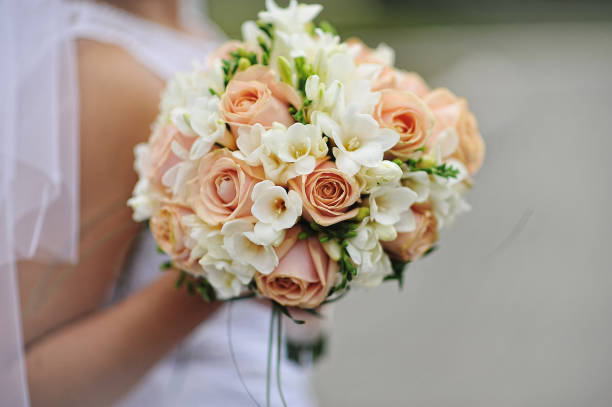 istock Wedding bouquet at hand of bride 672761622