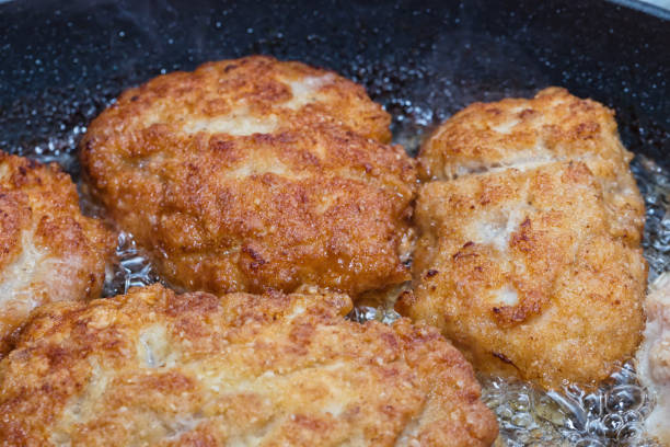 istock Cutlets from minced meat fried in a pan 672771820