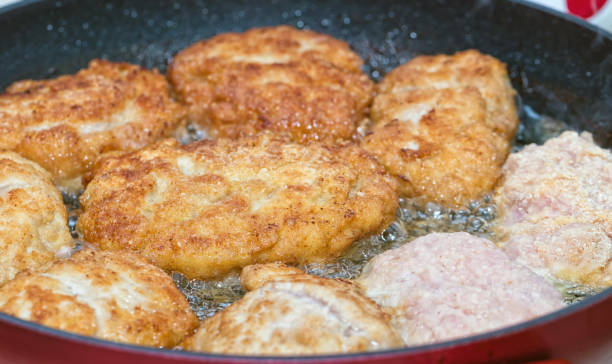 istock Cutlets from minced meat fried in a pan 672772022