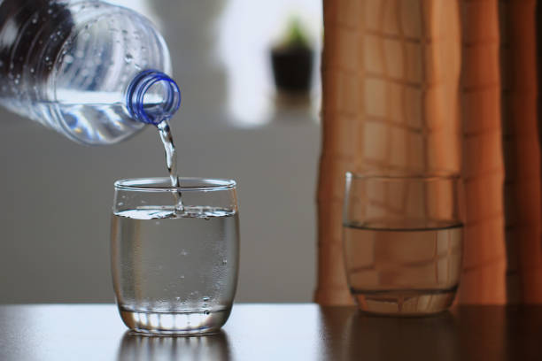 istock Glass of water on table 672775364