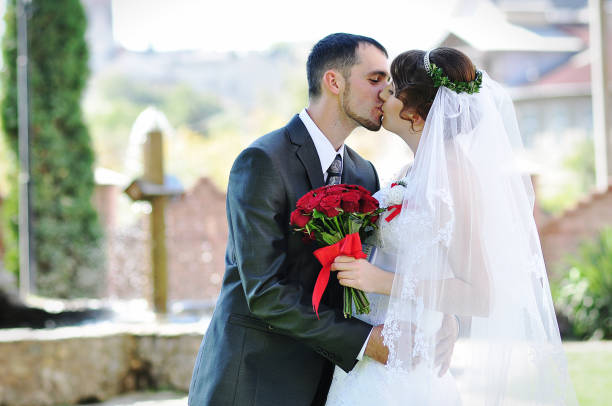 istock Wedding couple background cross with fountain 672788616