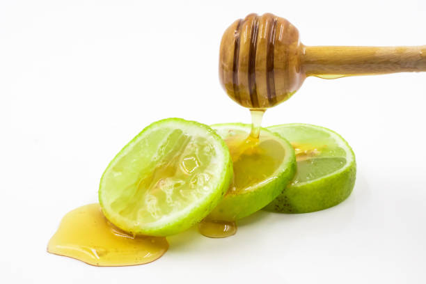 istock Honey and lemon on white background. 672788778