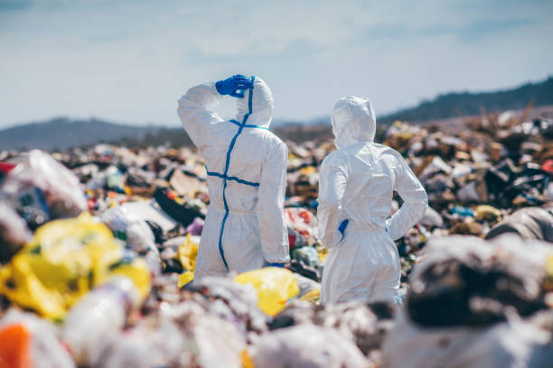 istock Recycling workers researching on the landfill 672793812