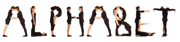 istock Black dressed people forming word ALPHABET 672809350