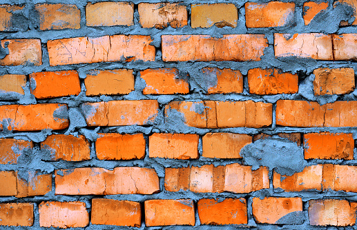 Fresh orange clay brickwork detailed texture background