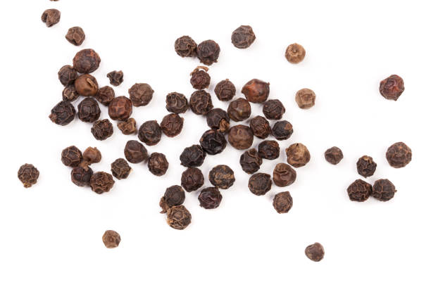 istock Black peppercorn isolated on white background. Top view 672815690