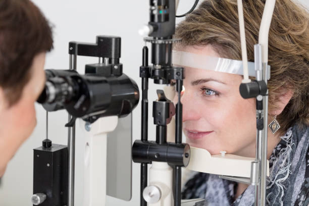 istock Female patient having eye examination 672823312