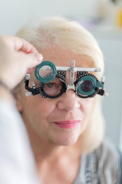 istock Testing eyesight to a senior woman 672823640