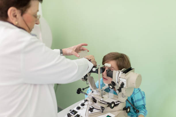 istock Kid at the eye doctor 672823800