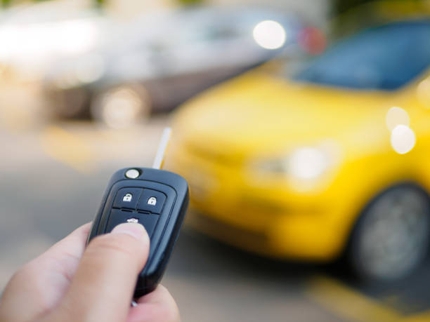 istock hand presses on the remote control car alarm systems 672824118
