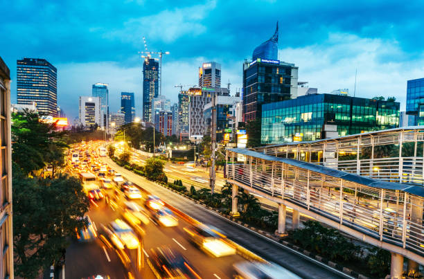 modern indonesia capital city Jakarta crowded street with many cars and motorcyles in Jakarta, Indonesia jakarta skyline stock pictures, royalty-free photos & images