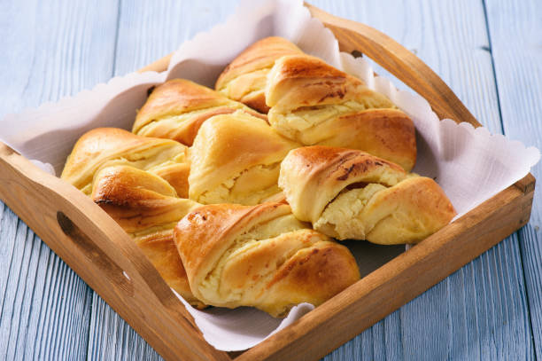 istock Homemade sweet bread rolls stuffed with cheese. 672828306