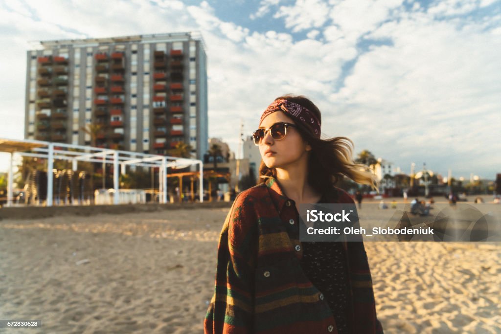 Woman walking on the seaside of Barcelona Young Caucasian woman walking on the seaside of Barcelona, Spain 20-29 Years Stock Photo