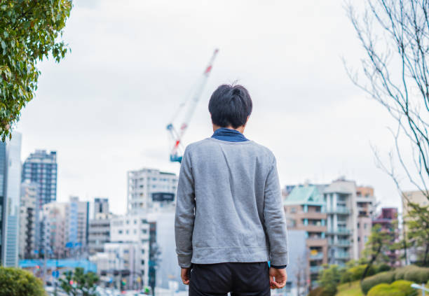 istock Man looking at the city 672832458