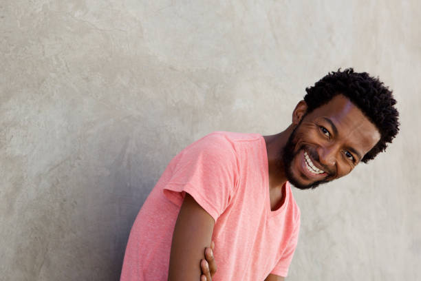 istock carefree african american man laughing 672845834