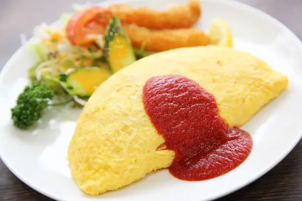 Photo of omelette with fried rice and shrimp tempura Japanese food