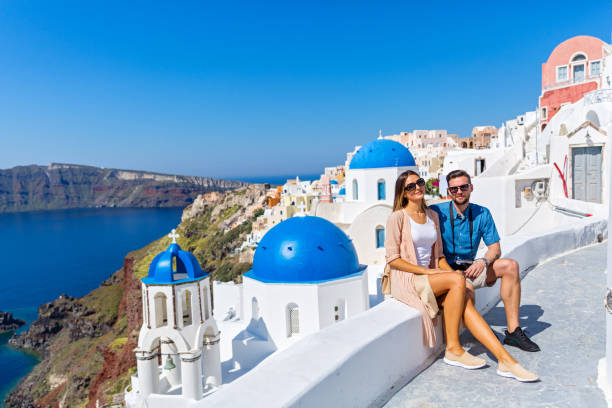 istock Young couple walking on Santorini 672852374