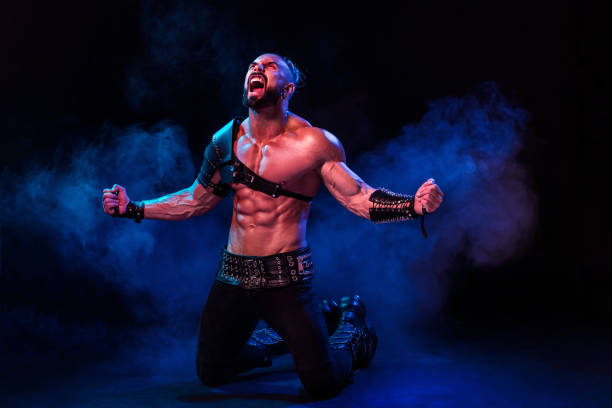 istock Young and muscular man performing a theatrical pose on  stag 672862838