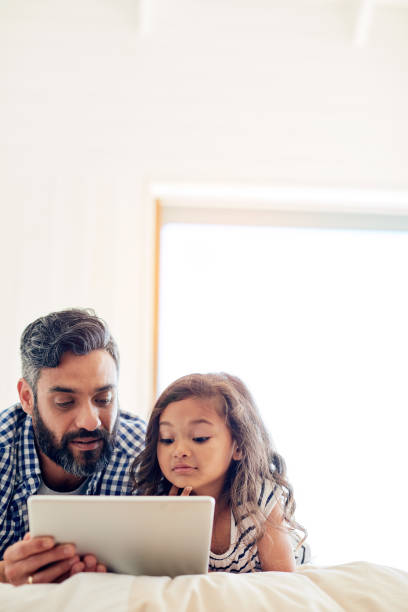 istock Let's choose something to watch 672880378