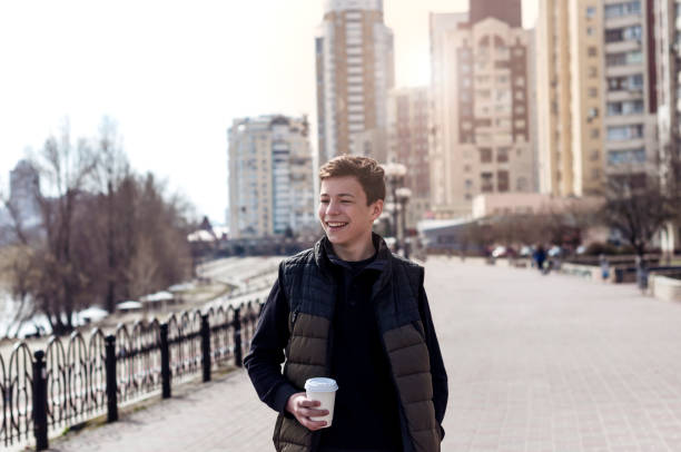 Happy young man on a city street
